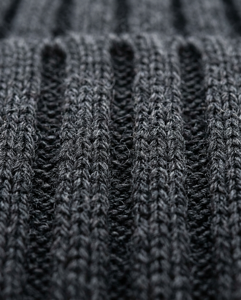 Deep ribbed knit fabric texture of the Half-Zip Sweater Ribbed Meridian in charcoal