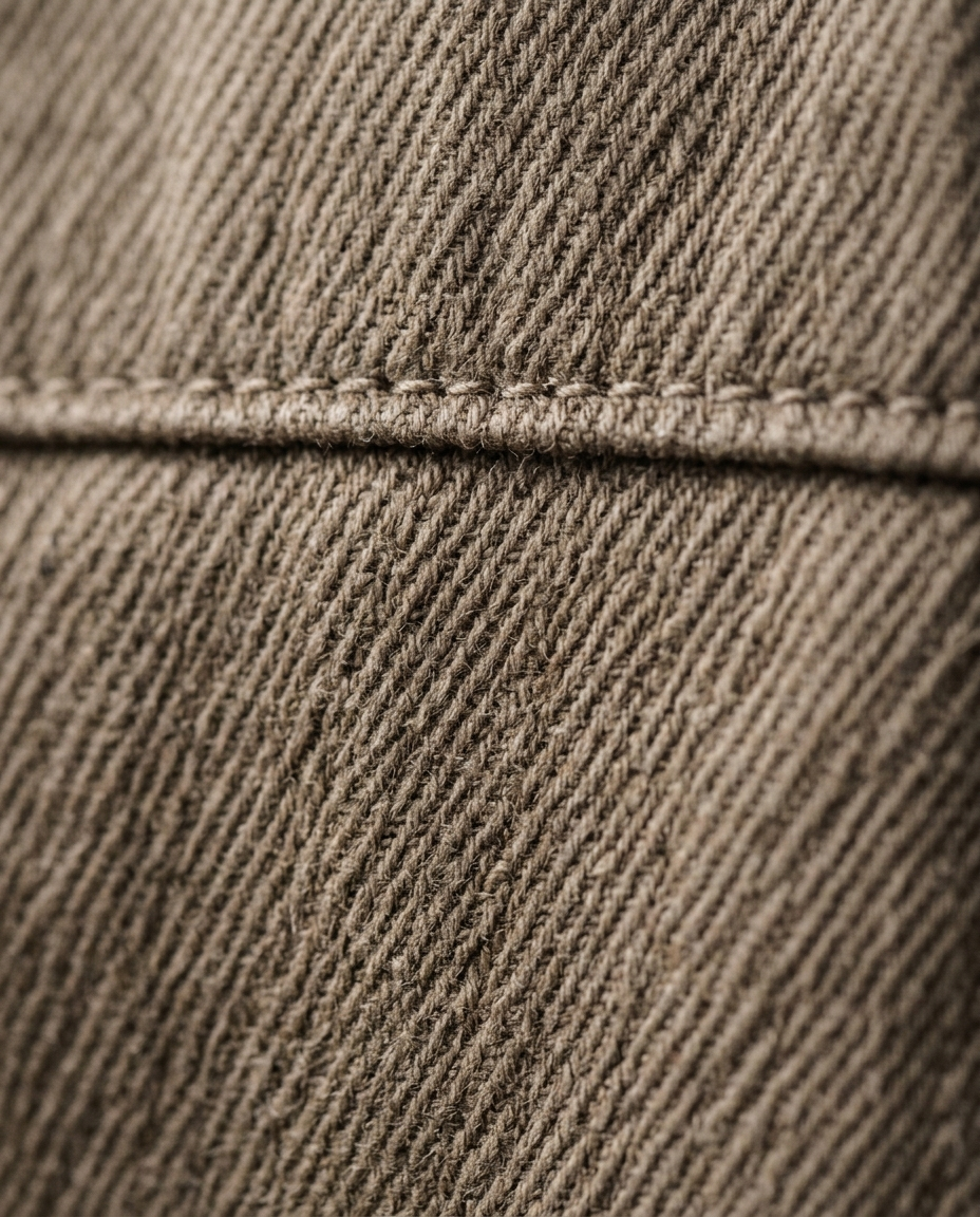 Cotton twill fabric texture of the Field Jacket Lined Wayfarer in stone